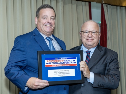 Tom Hart, President for IUOE Local 94 receives “Hero”  award from Executive Director of 911 Health Watch, Ben Chevat.