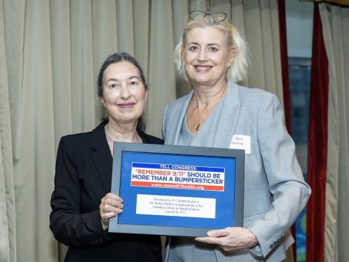 Dr. Robin Herbert receives “Hero” award from Dr. Jacqueline Moline.